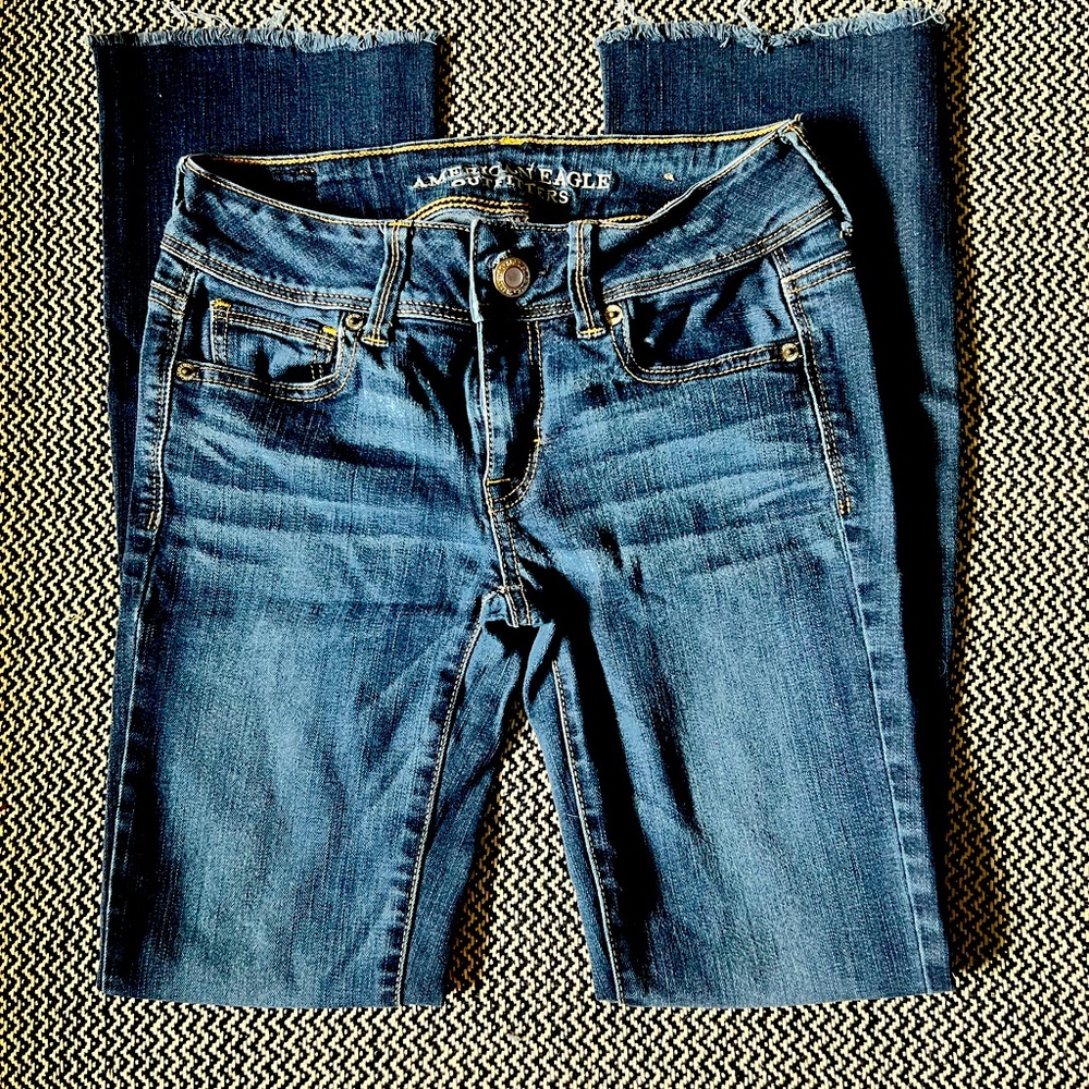 American Eagle Kick Boot cut with frayed bottoms size 0 dark washed